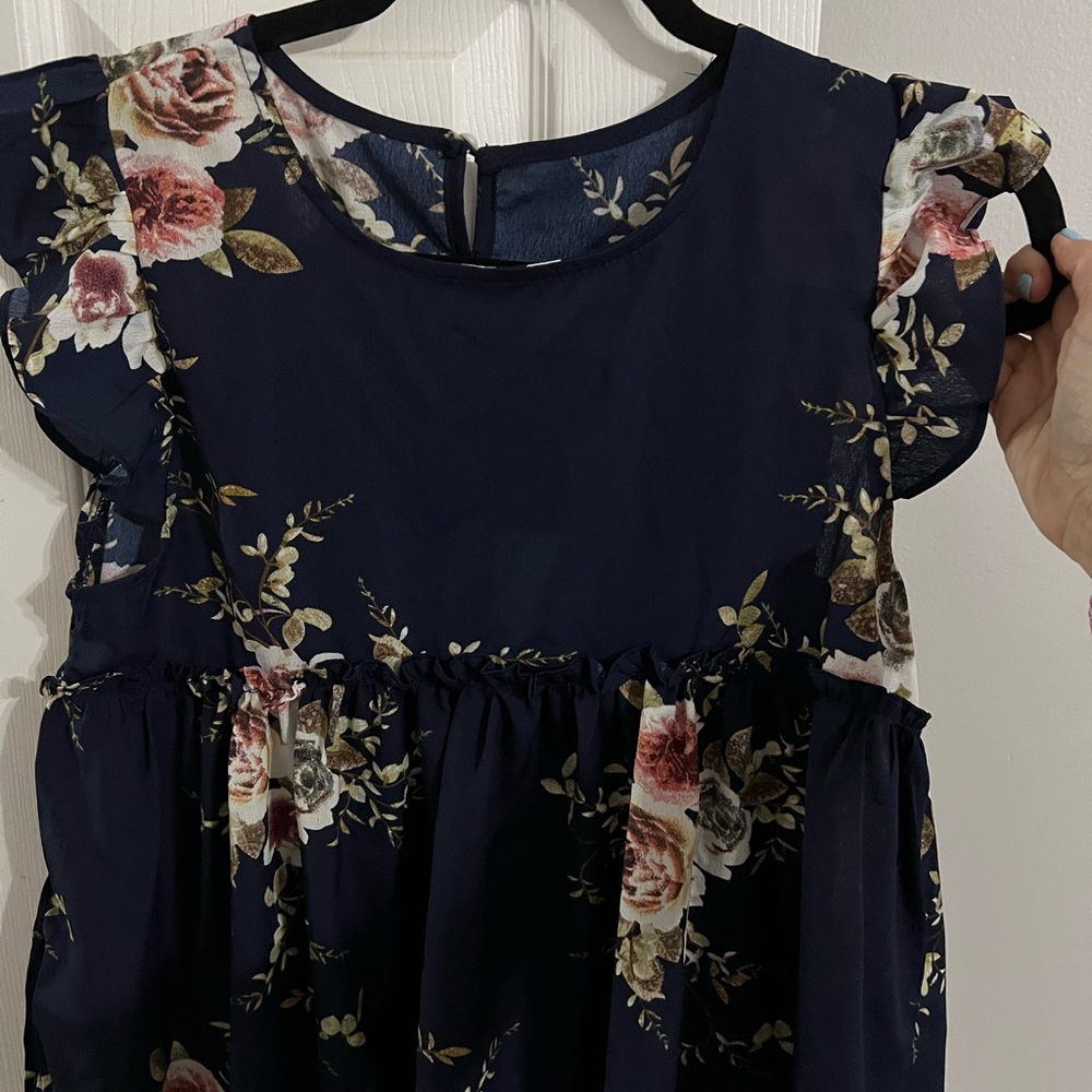 Blouse with empire waist and flowy at the bottom! Did not fit.. maybe wore once